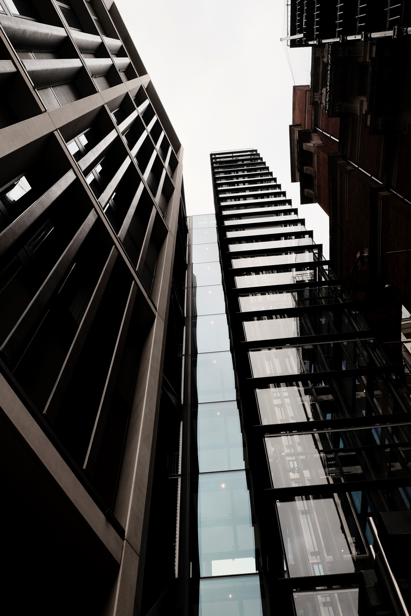 Tall modern architecture buildings against a pure white sky